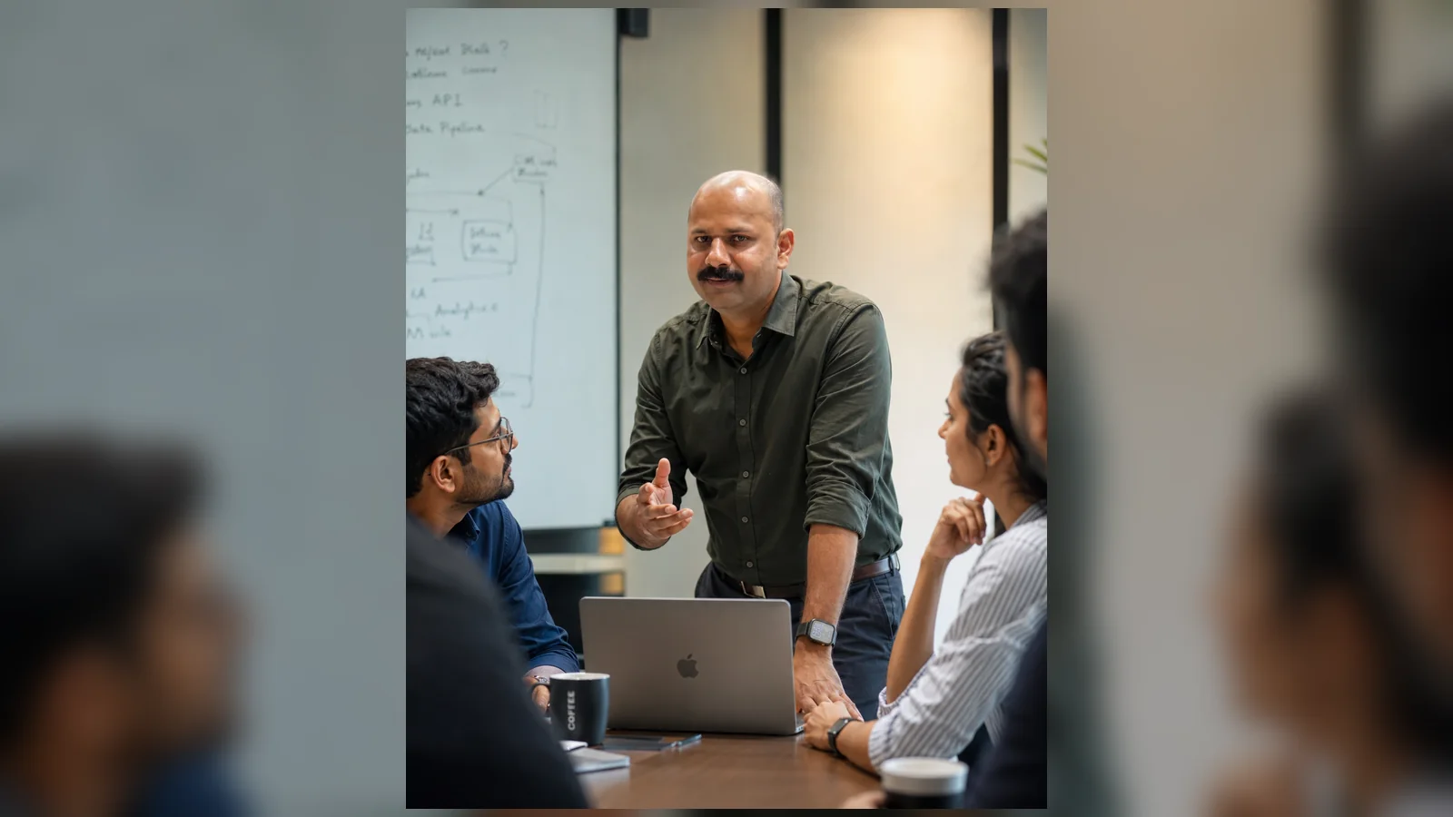 Reji Modiyil leading a strategy discussion with a business team
